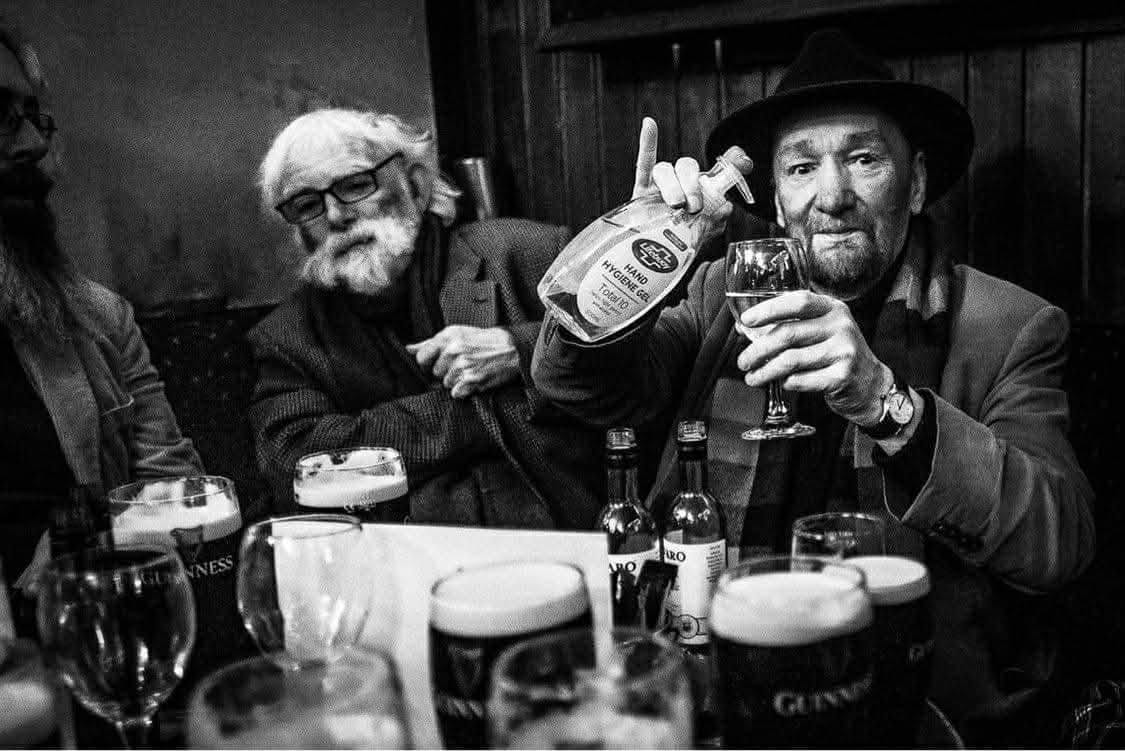 Kieran Devaney raising a glass with friends